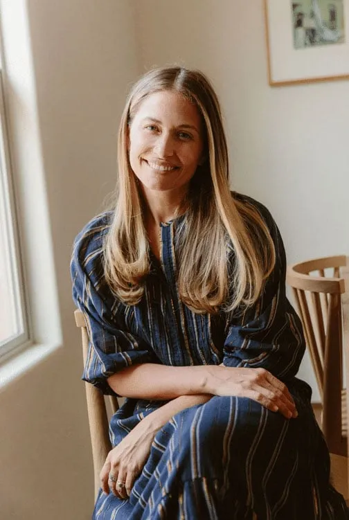 Valleybrink Road's founder seated in a sunlit room