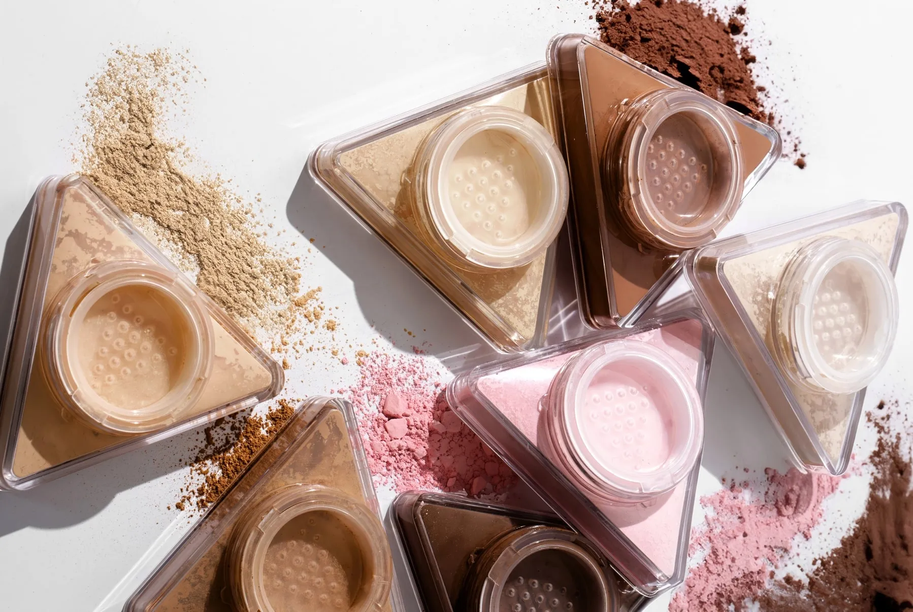 LYS Beauty triangular setting powders with loose powder swatches